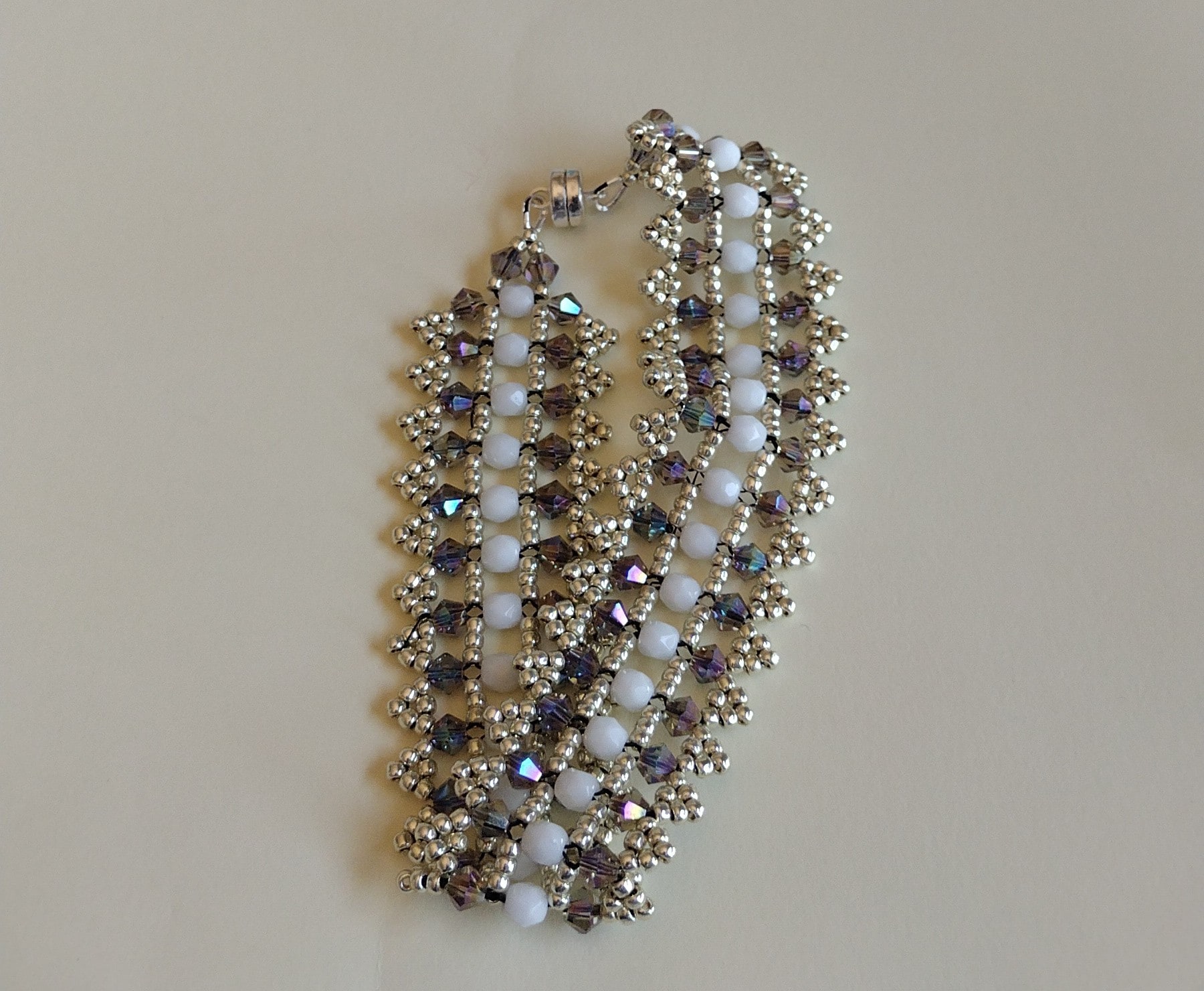 Black Diamond Crystal Bracelet arranged in a circle, showing its magnetic clasp