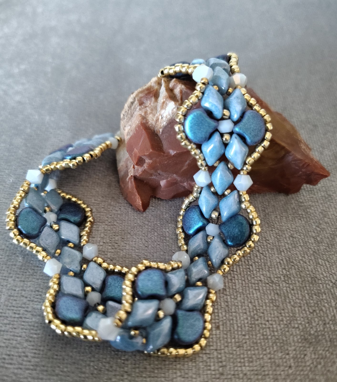 Blueberry Blues Bracelet arranged around a red stone