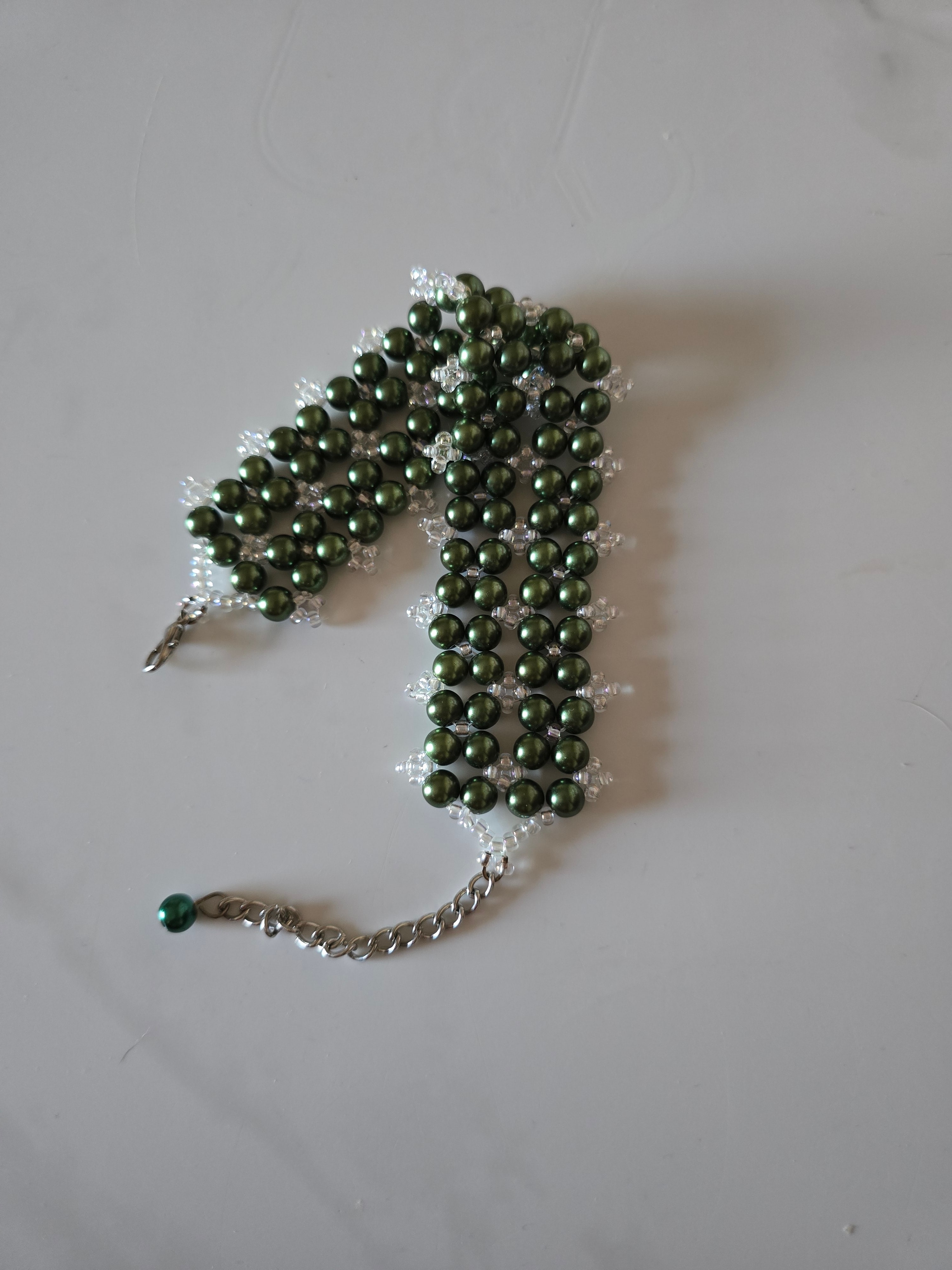 Full length of Forest Canopy green glass pearl cuff bracelet with its extender chain