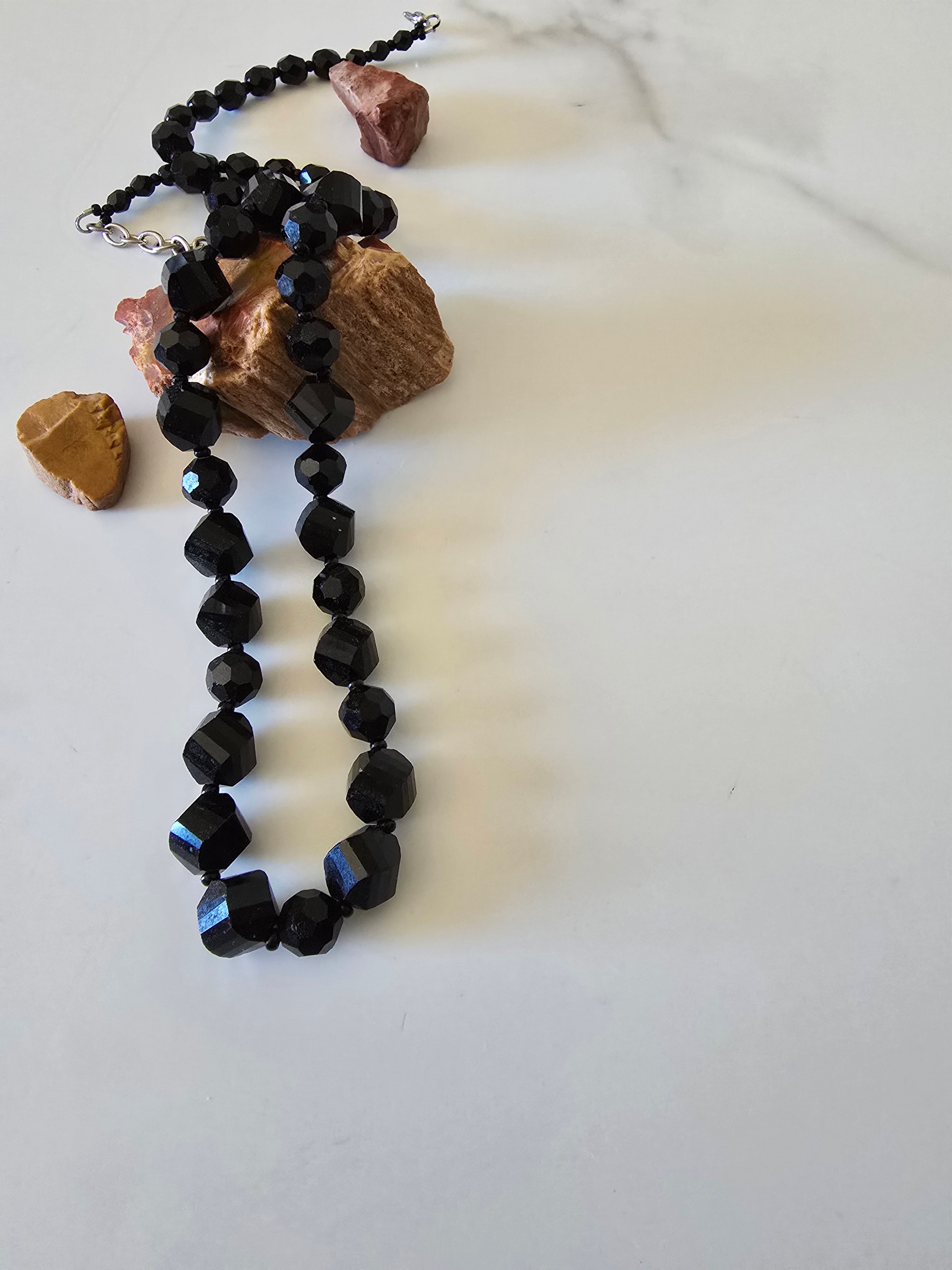 Midnight Sparkle black faceted-bead necklace arranged with natural stones