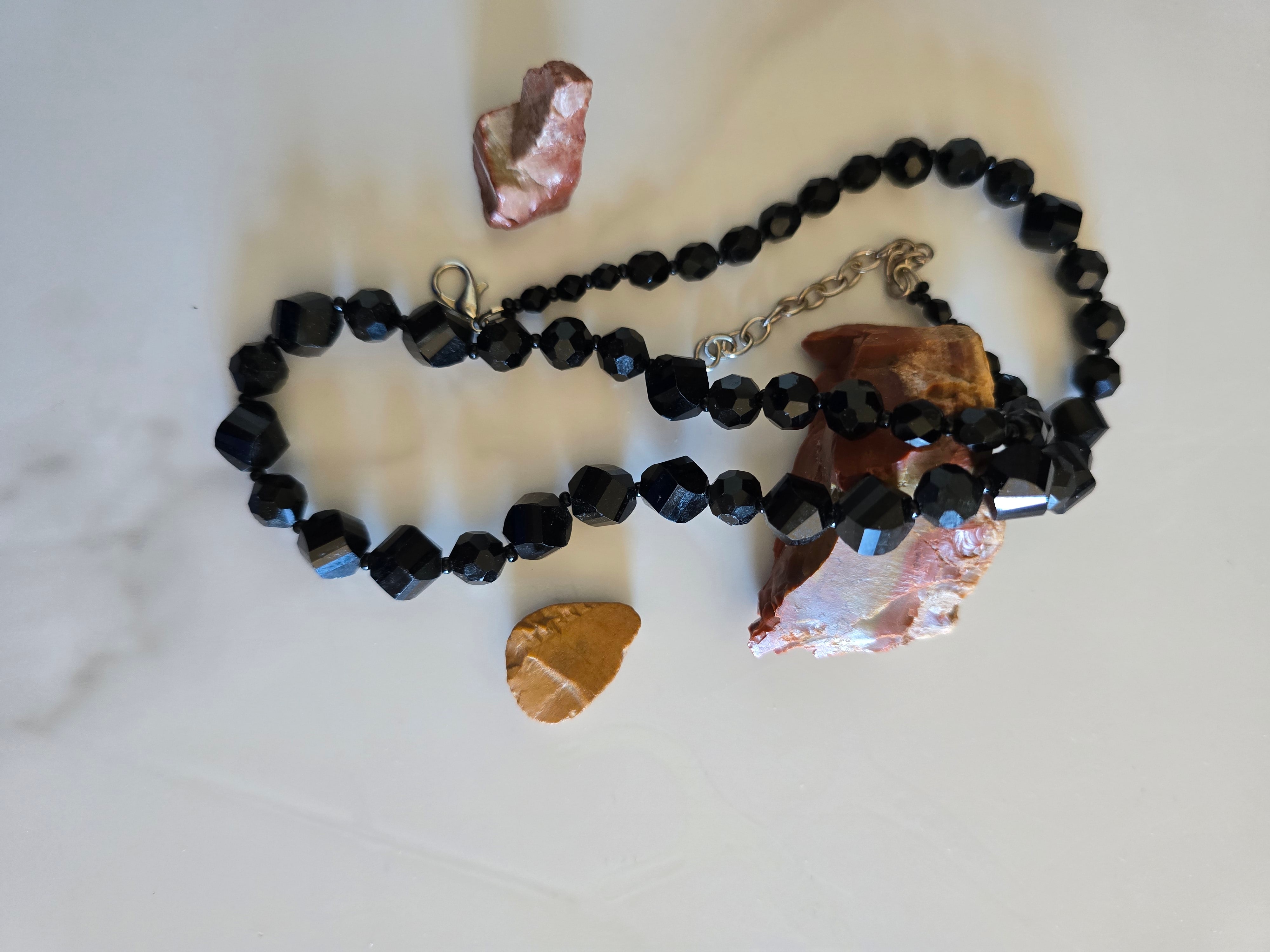Midnight Sparkle black faceted-bead necklace arranged with natural stones