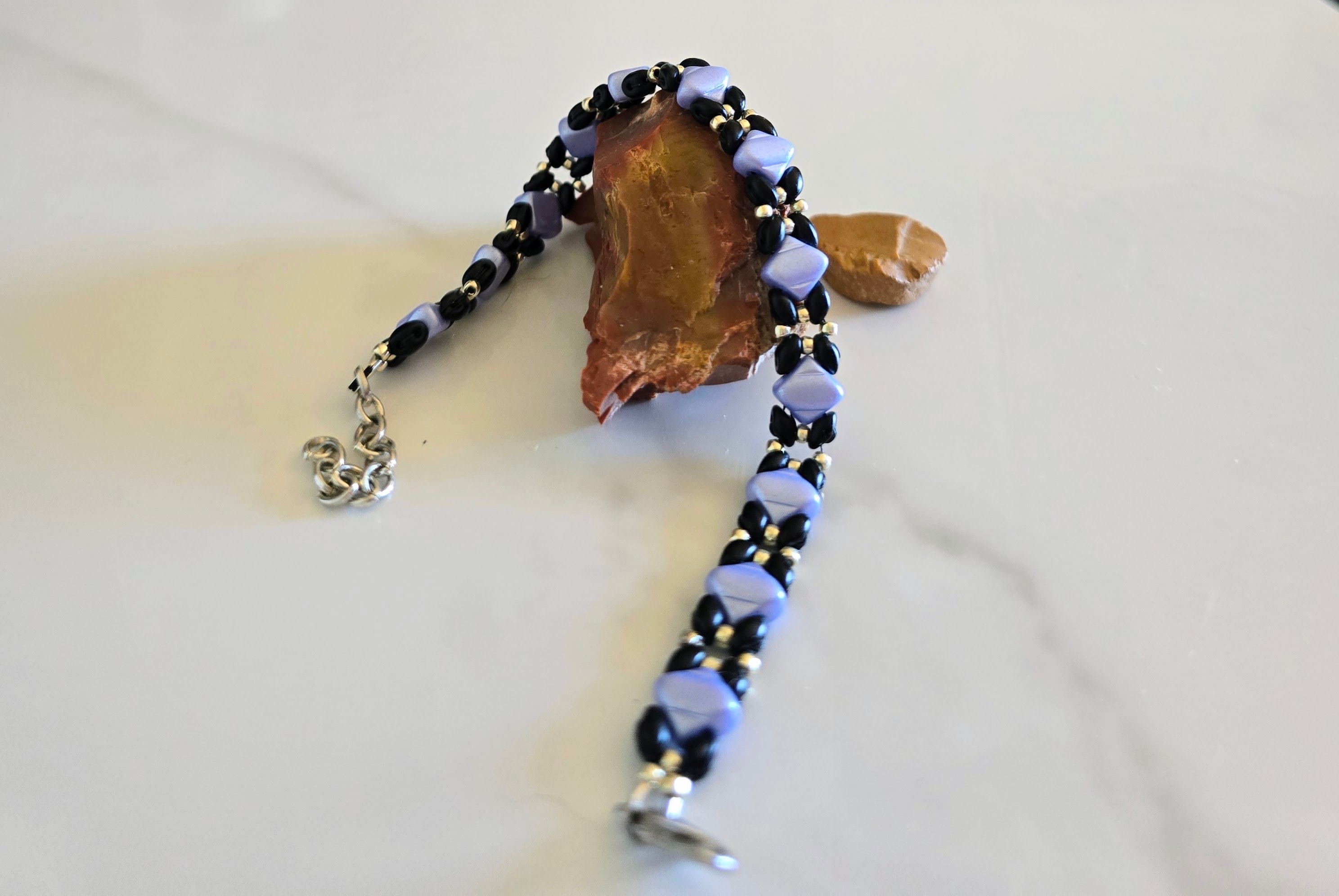 Periwinkle Silk bracelet arranged with natural stones, showing its clasp and extender chain