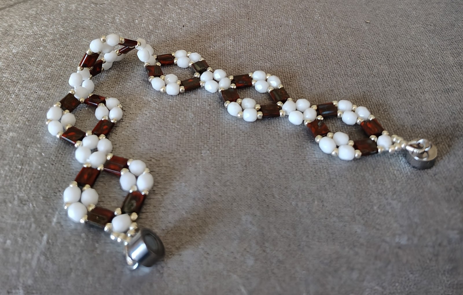 Picasso Red Tila bracelet laid flat, showing its full length
