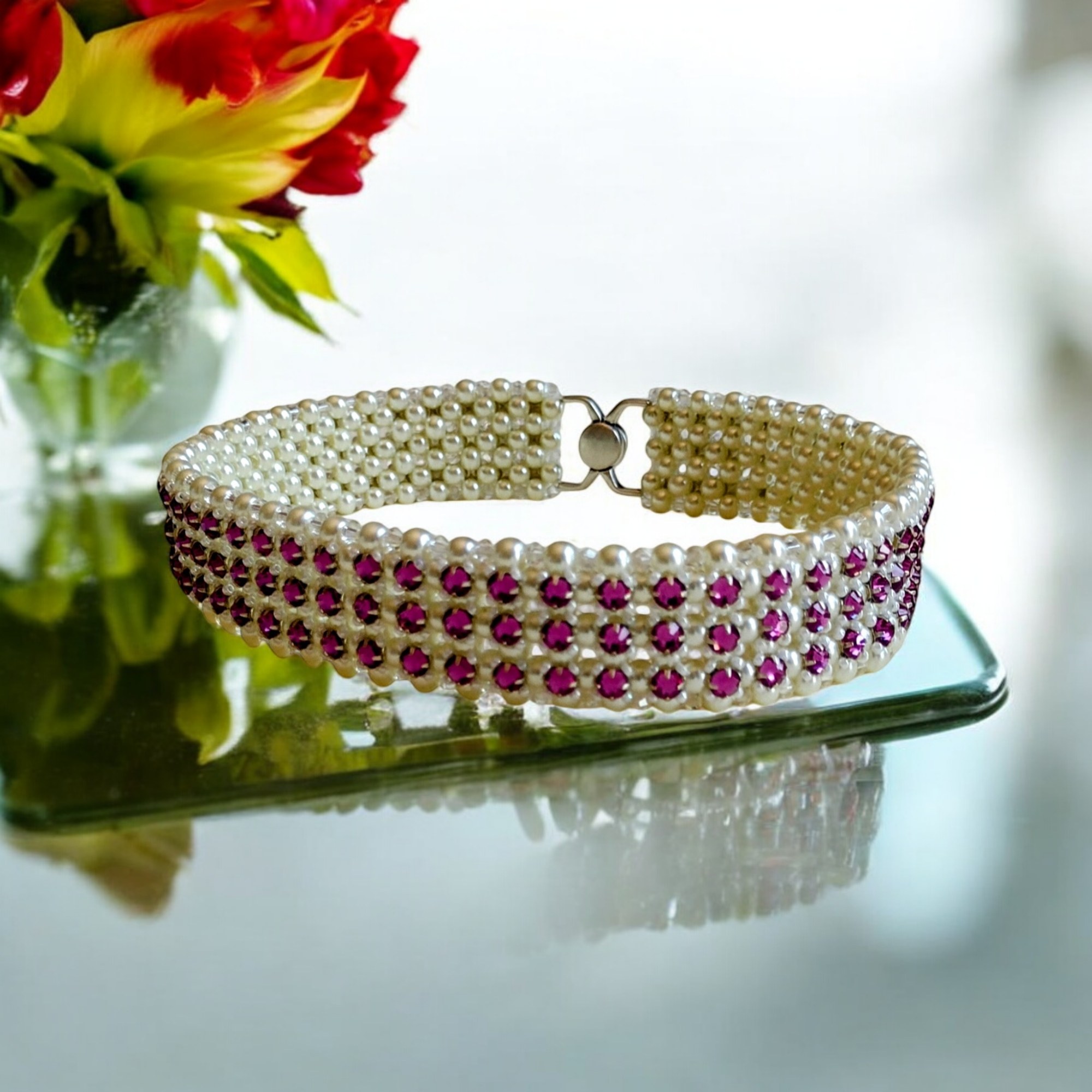 Radiant Fuchsia Crystal and Pearl Star Choker on a mirrored display
