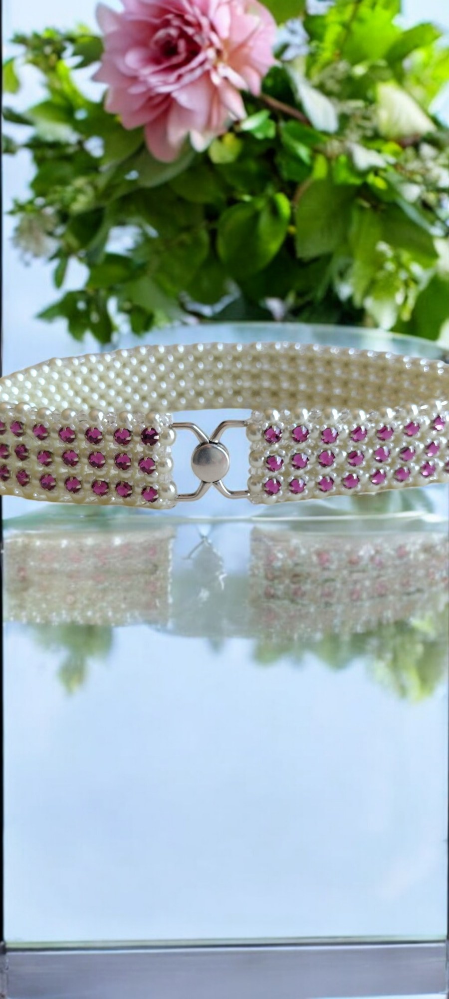 Radiant Fuchsia Crystal and Pearl Star Choker on a mirrored display