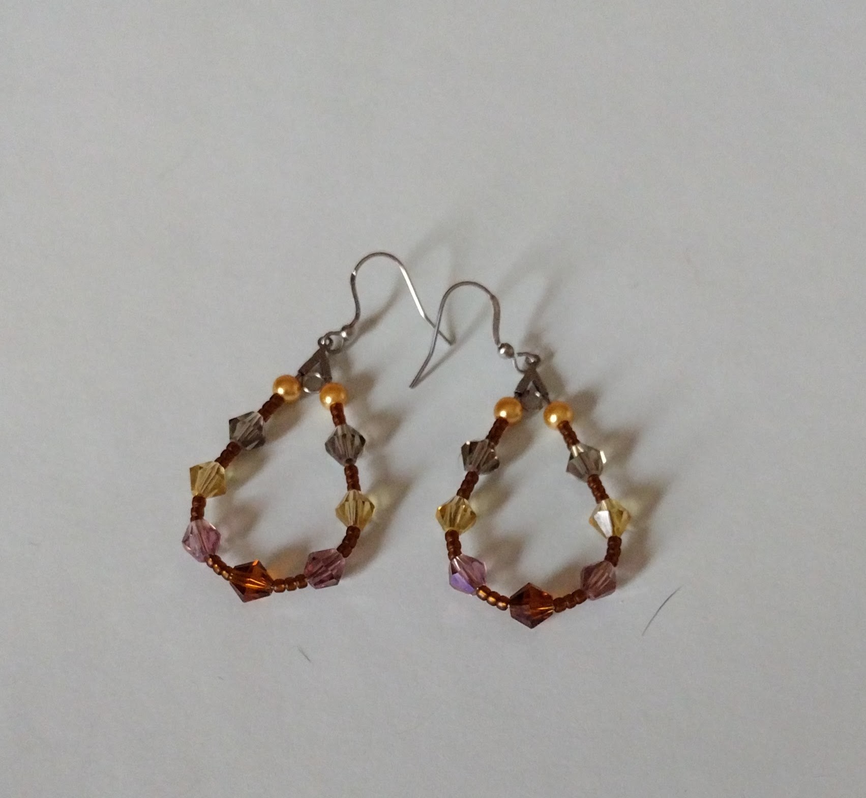 Matching Rootbeer earrings displayed together