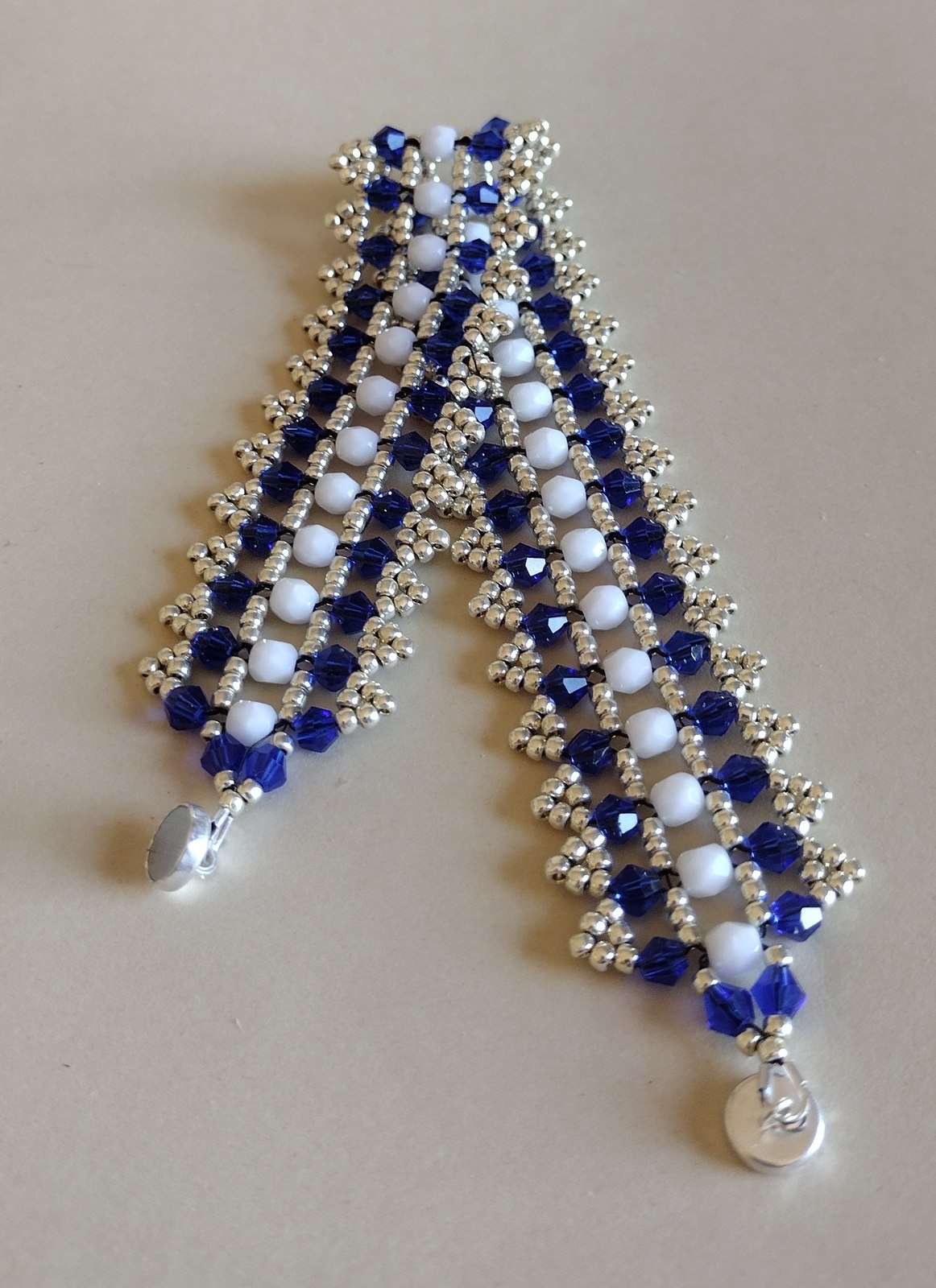 Sapphire Crystal Bracelet laid flat, showing the full length and magnetic clasp