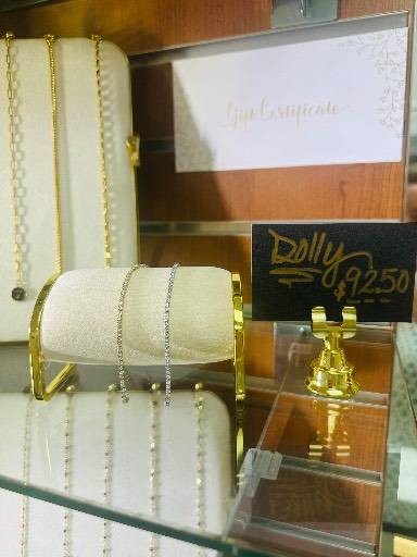 Gold and silver chains on display at Elise Privé