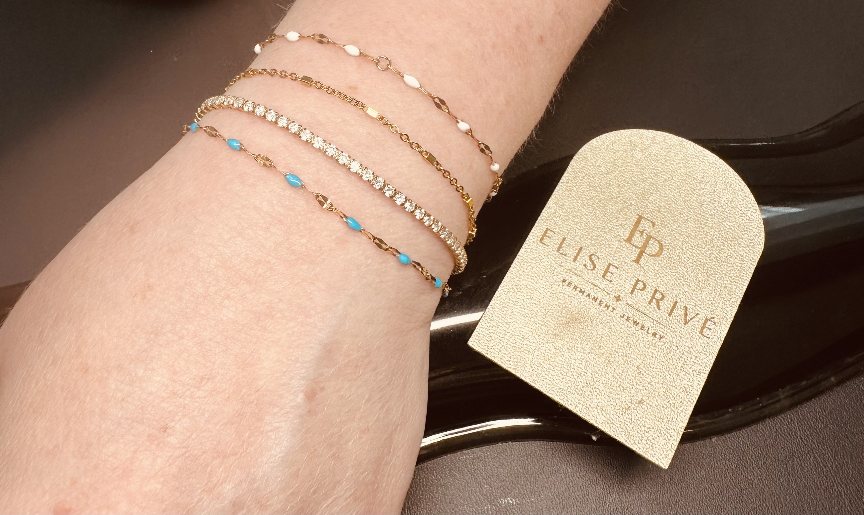 Layered permanent bracelets with gemstone detail
