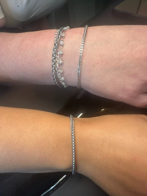 Silver permanent bracelet on a wrist