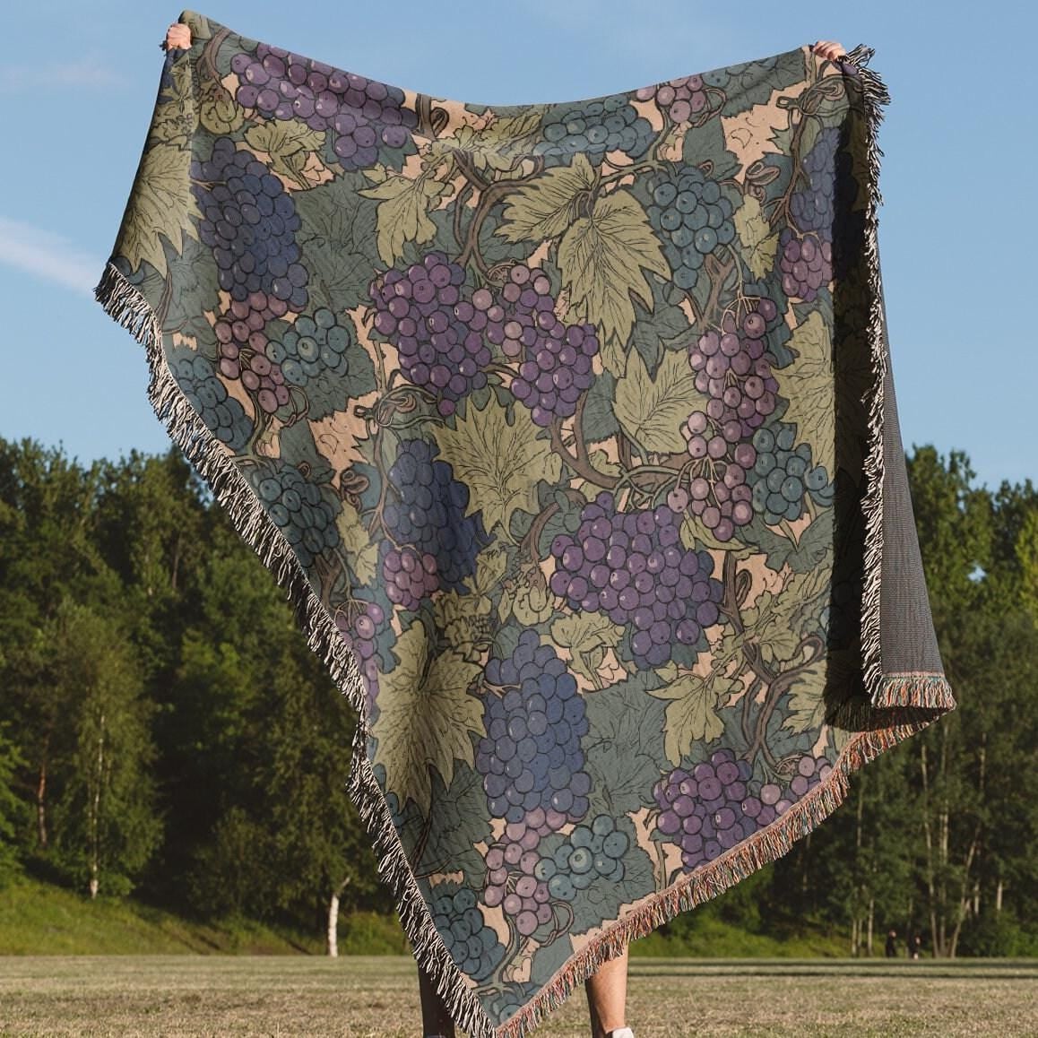 Close view of a detailed floral design woven into a cotton tapestry blanket