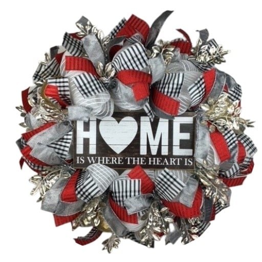 Home-themed wreath with red, black, white, and silver ribbon