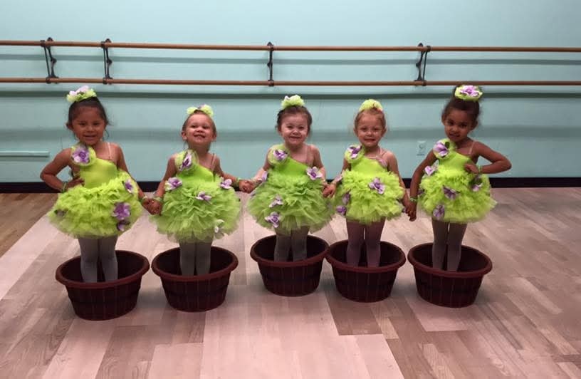 Young DMSD dancers in green flower costumes