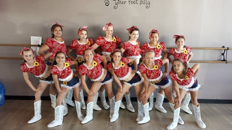 DMSD dancers in red recital costumes