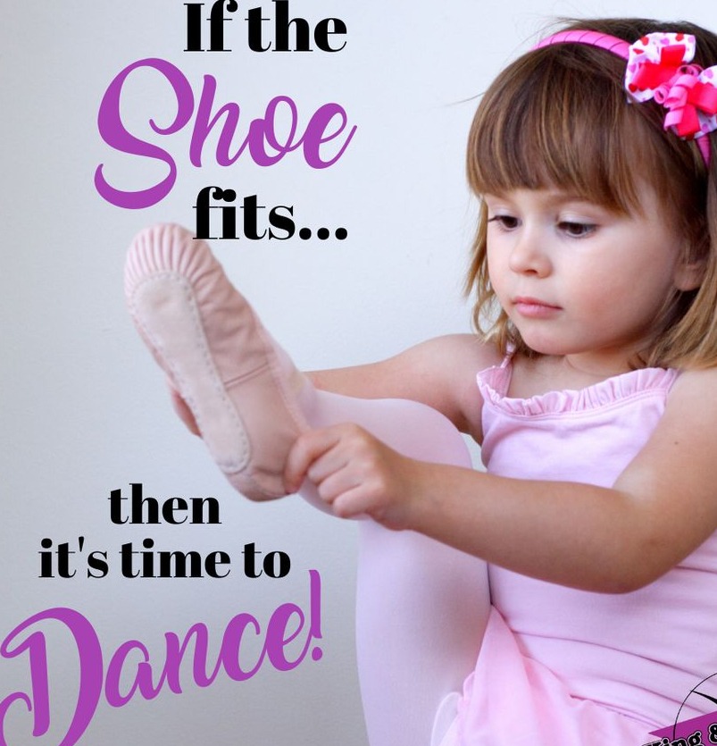 A young dancer trying on a ballet shoe. If the shoe fits, then it’s time to dance!