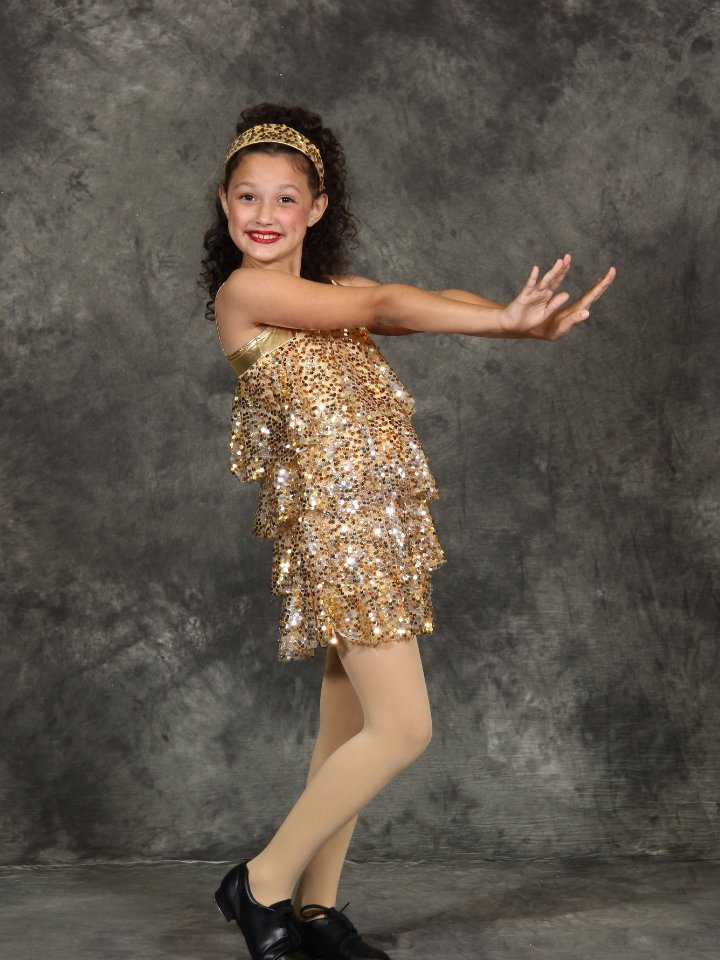 Dancer in a gold recital costume