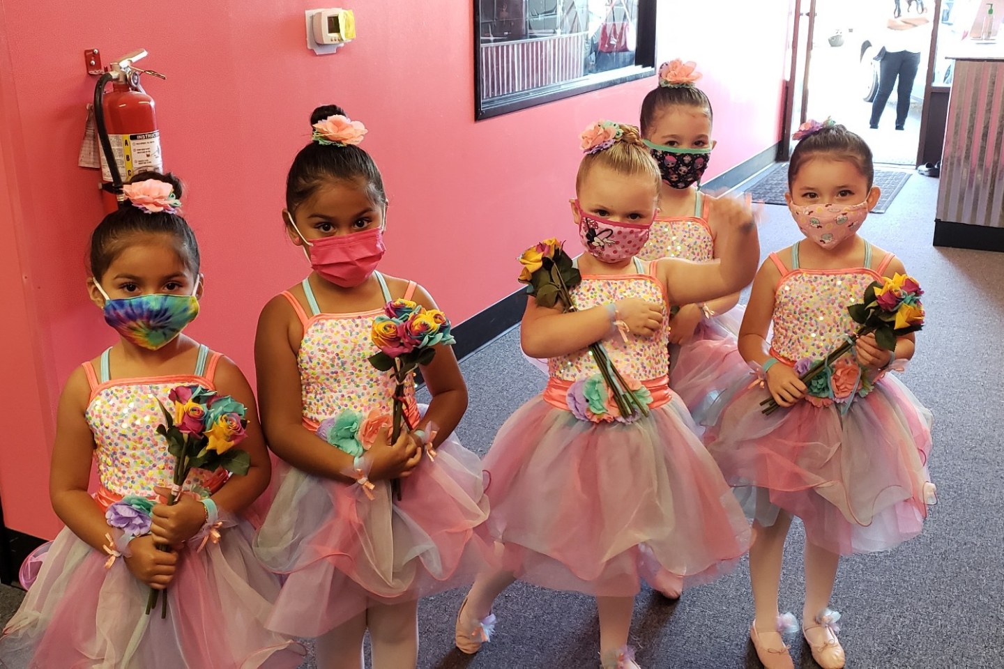 Young ballerinas celebrating together at the studio