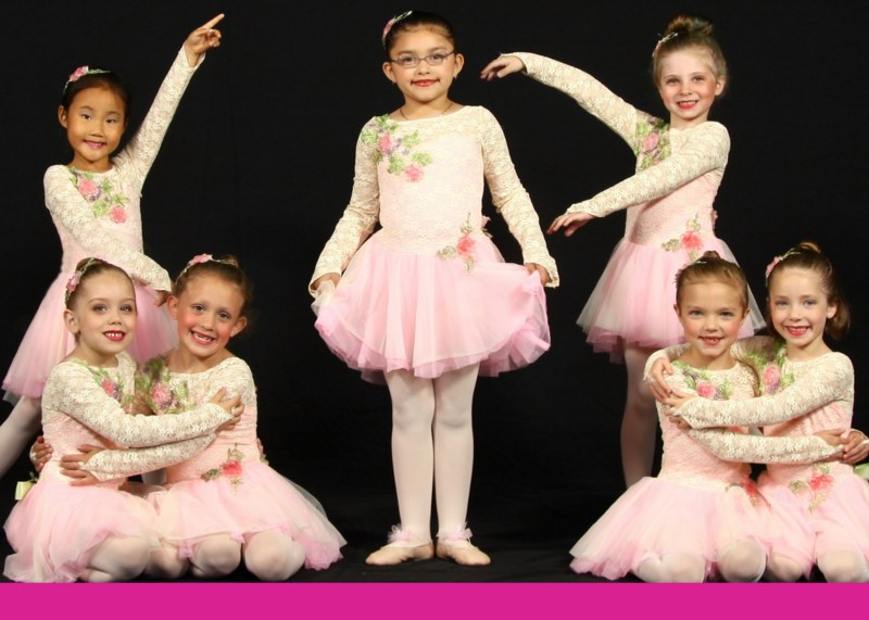 Young dancers smiling during a class at Deborah Messinger School of Dance