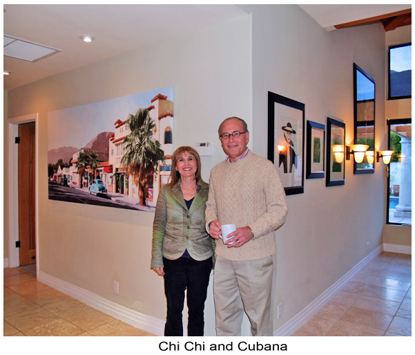 Collectors standing beside Chi Chi and Cubana in their home