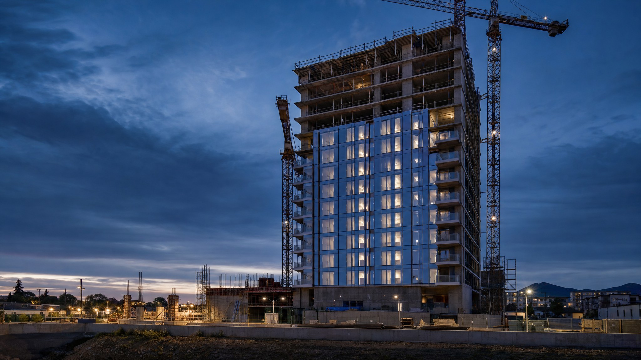 Multifamily building under construction at dusk