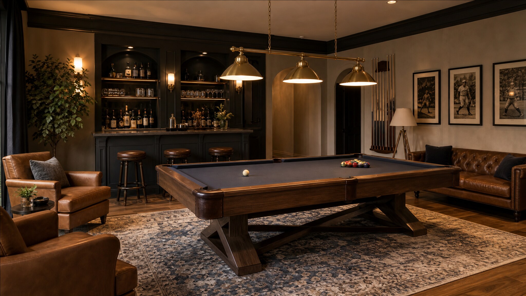 A refined game room with a walnut pool table, leather seating, bar cabinetry, and brass billiard lights