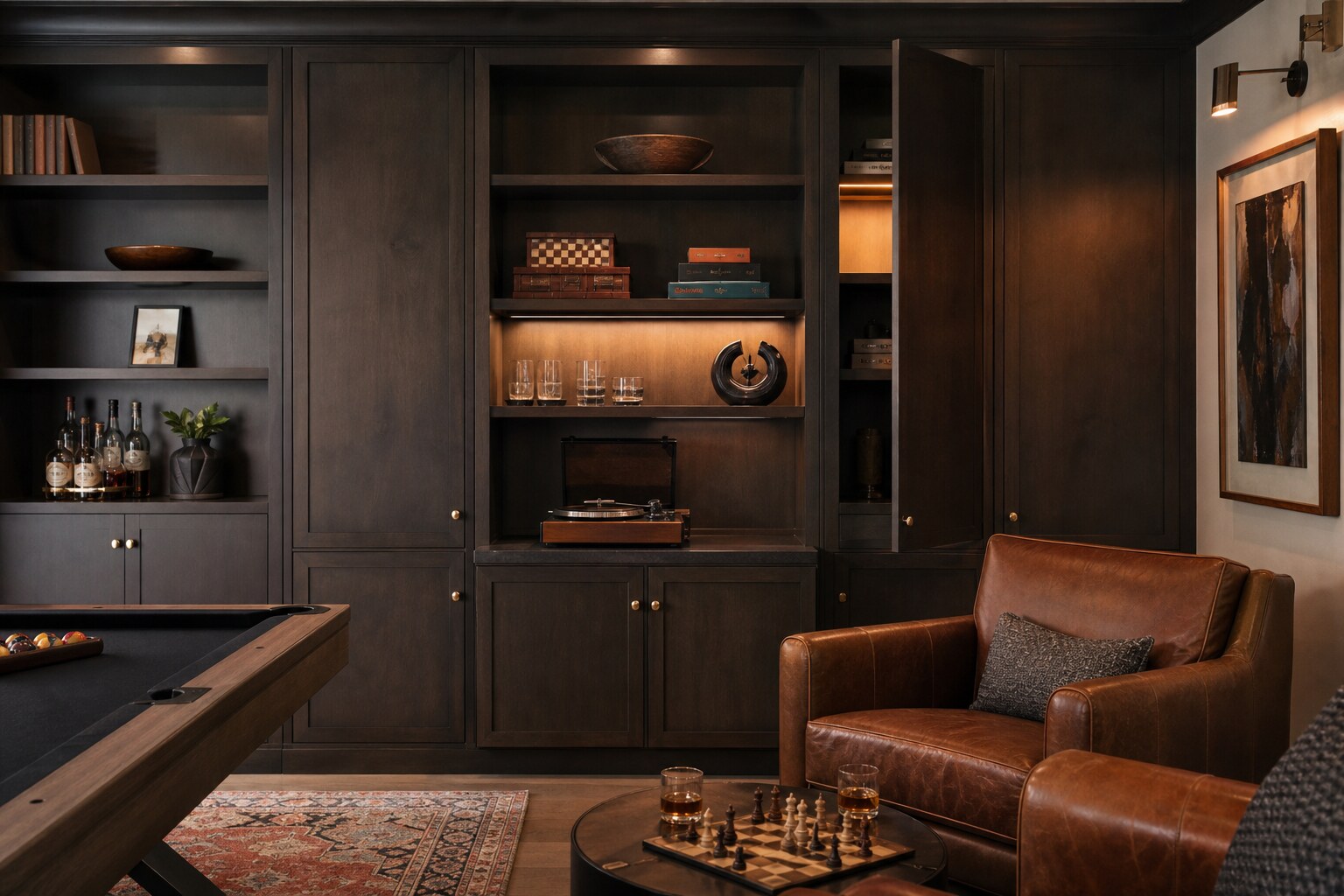 Dark wood game room cabinetry with board games, glassware, a record player, and concealed storage