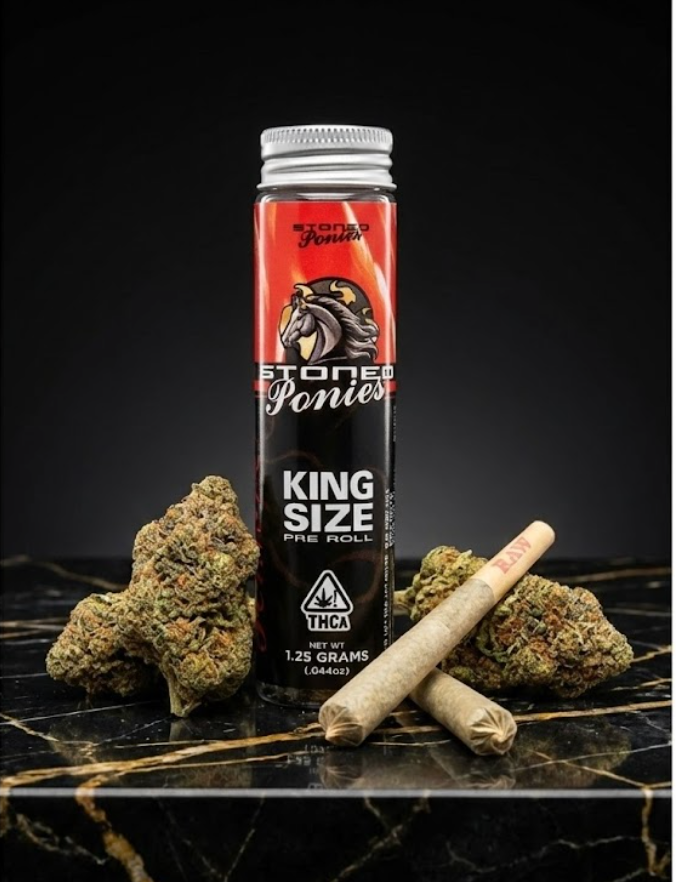 Stoned Ponies king-size pre-roll tube beside flower and two pre-rolls