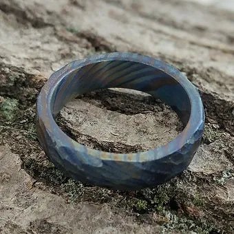 Three-layer twist titanium Damascus ring with flame-anodized color