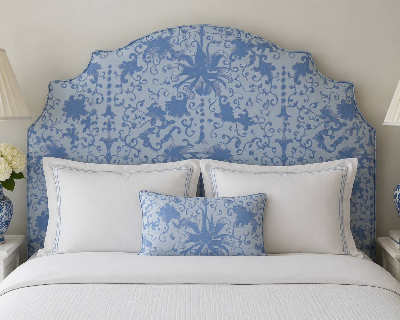 Blue patterned upholstered headboard with a matching accent pillow