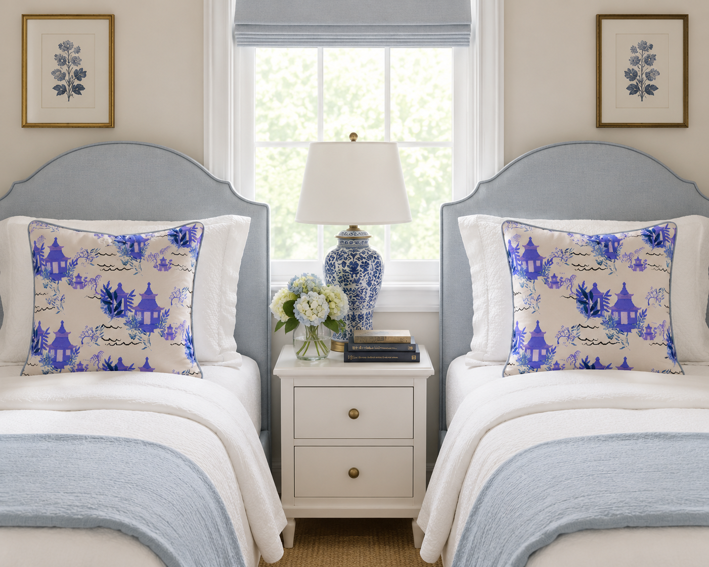 Blue toile pillows in a twin bedroom