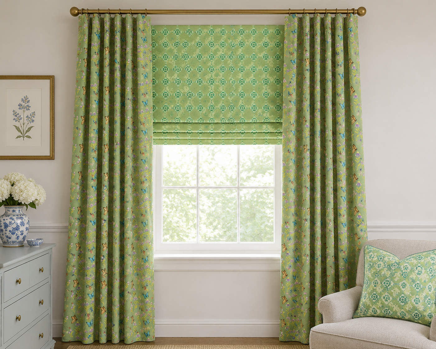 Green patterned drapery and Roman shade
