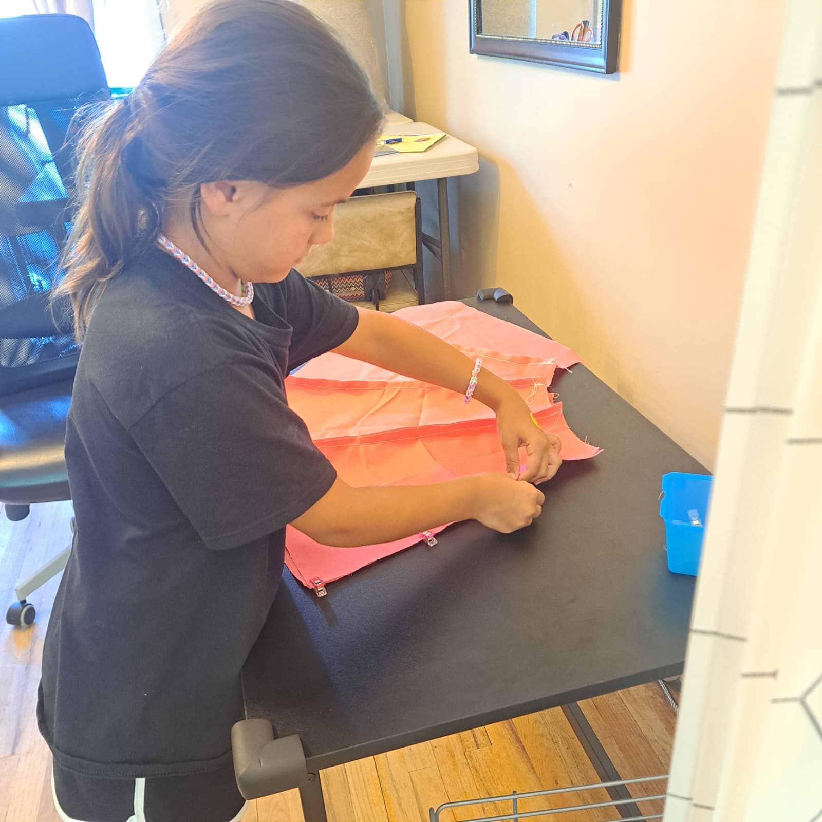 Measuring fabric at PYAJ Sewing Studio