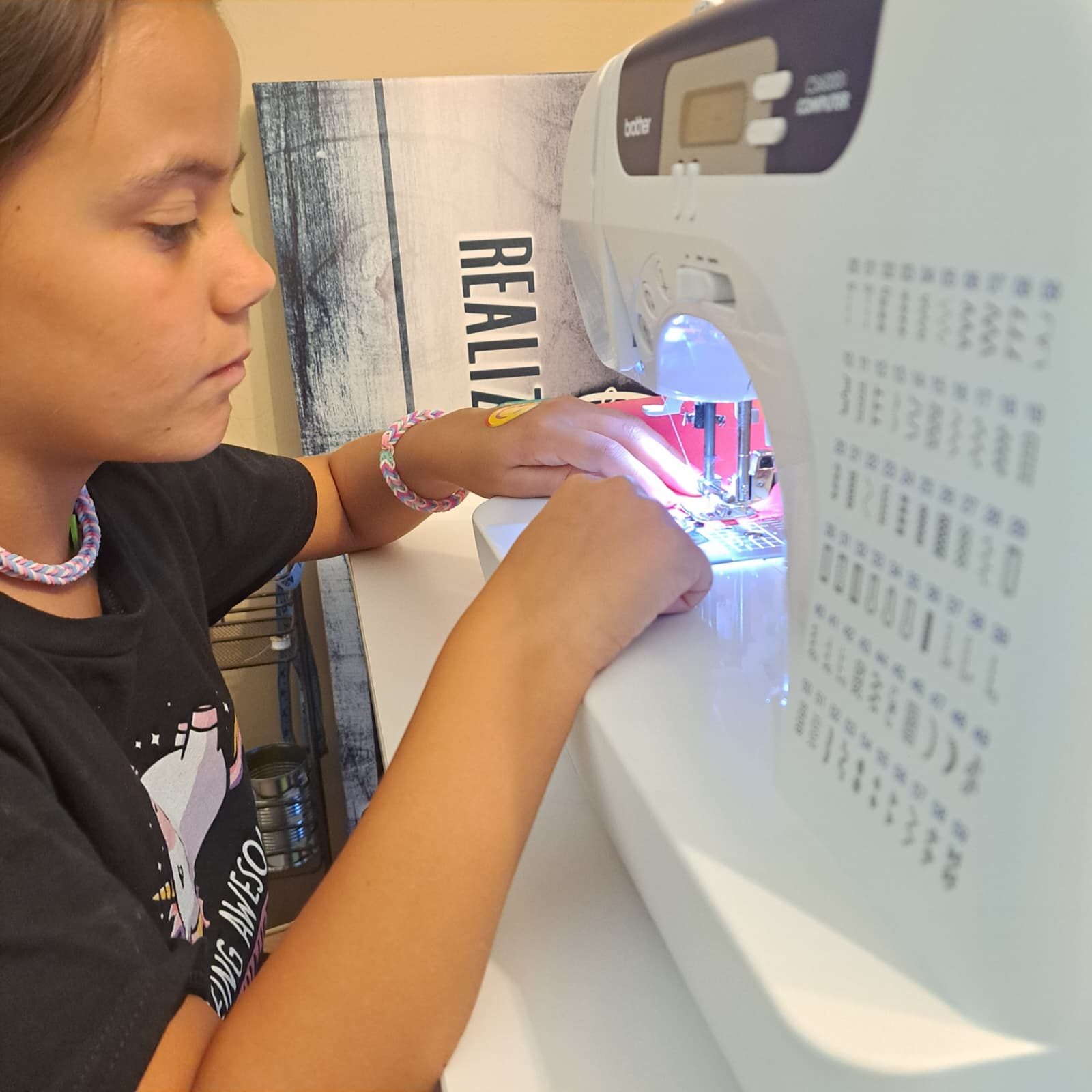 Stitching at the machine at PYAJ Sewing Studio