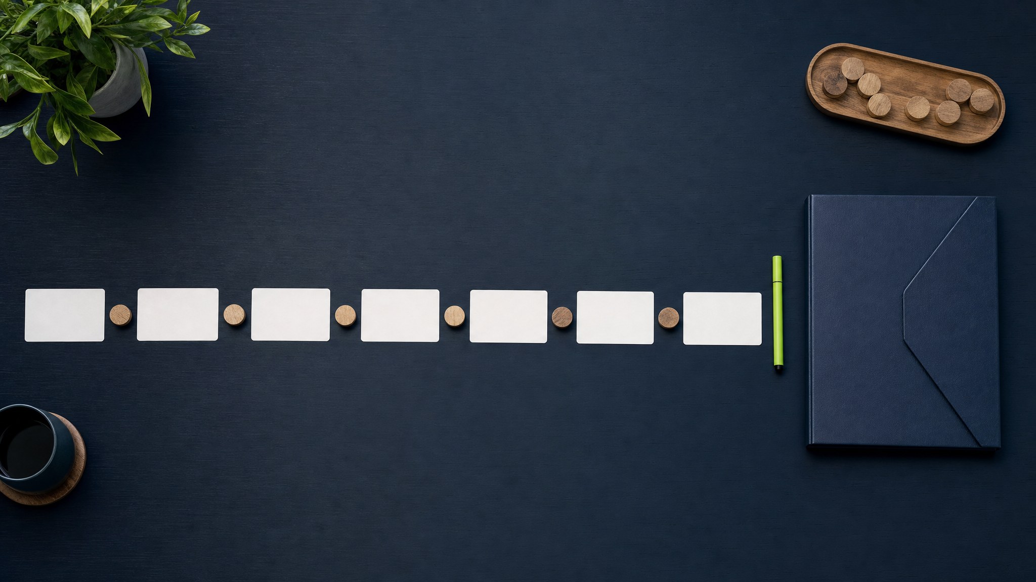 Blank cards and wooden tokens forming a path toward a presentation folder