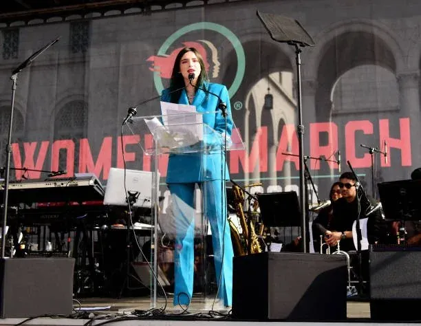 Emiliana Guereca speaking from a stage at a Women’s March gathering
