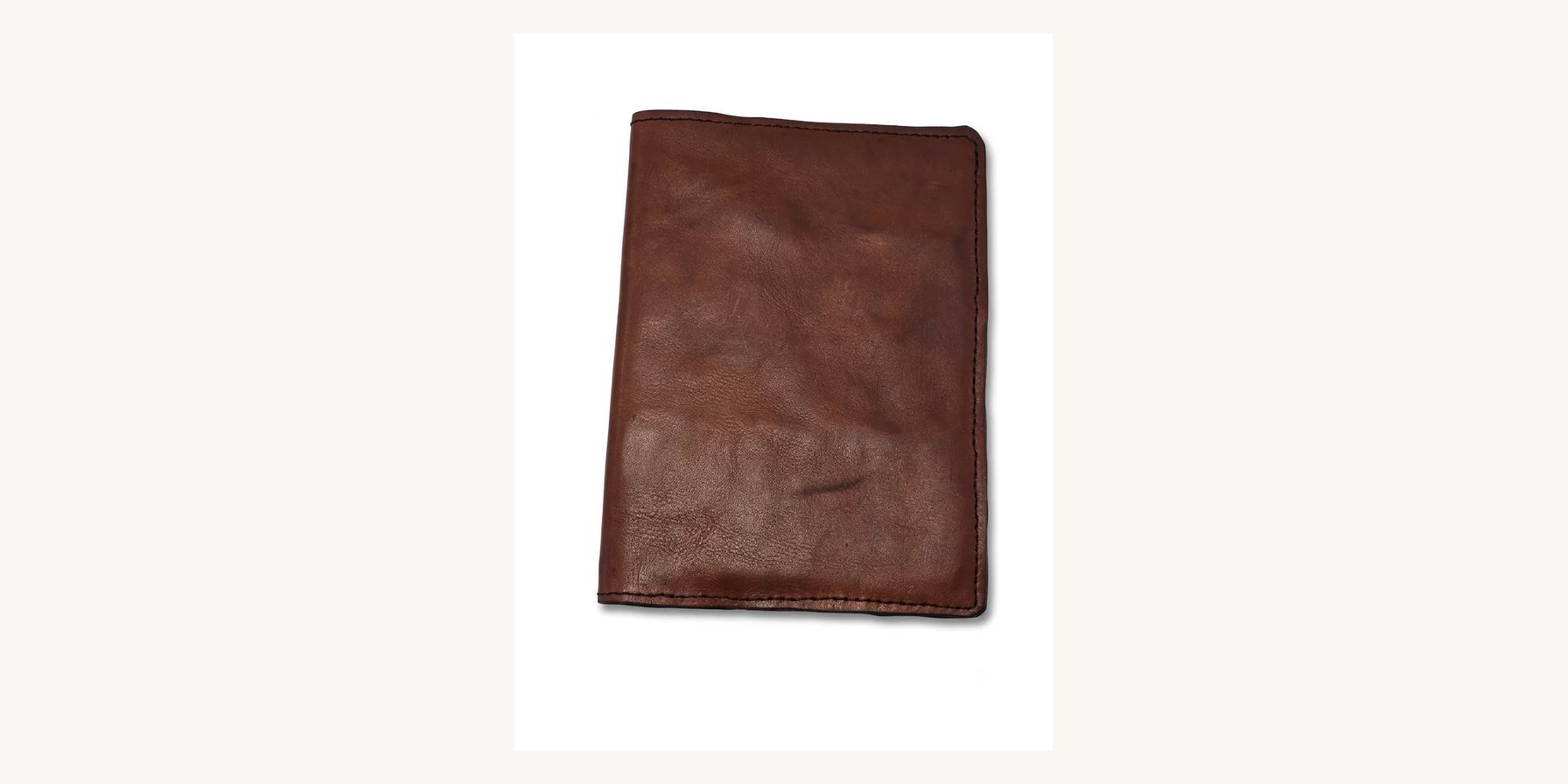 Handmade brown leather journal cover showing natural grain and patina