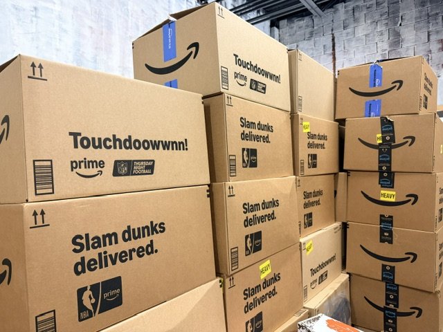 Stacked overstock shipping boxes at Underground Deals KC