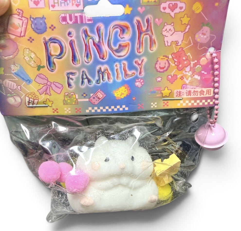 White soft squishy character in Pinch Family packaging