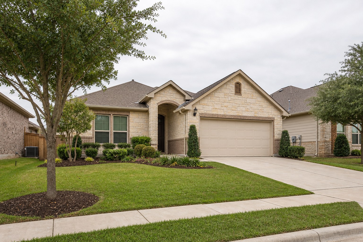Well-maintained Texas home exterior with a clean lawn and planting beds