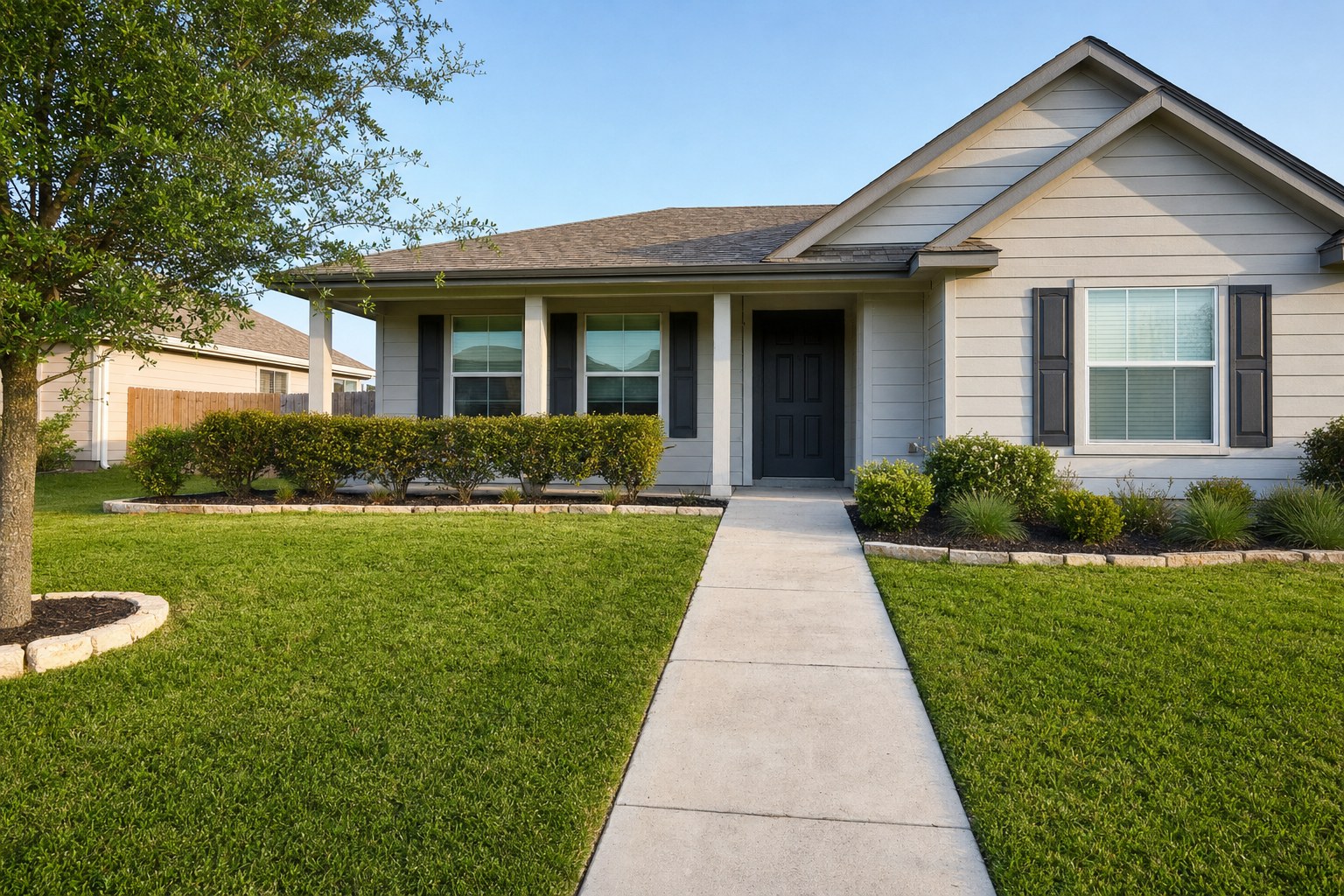 Well-kept rental home exterior with a clear walkway and maintained lawn