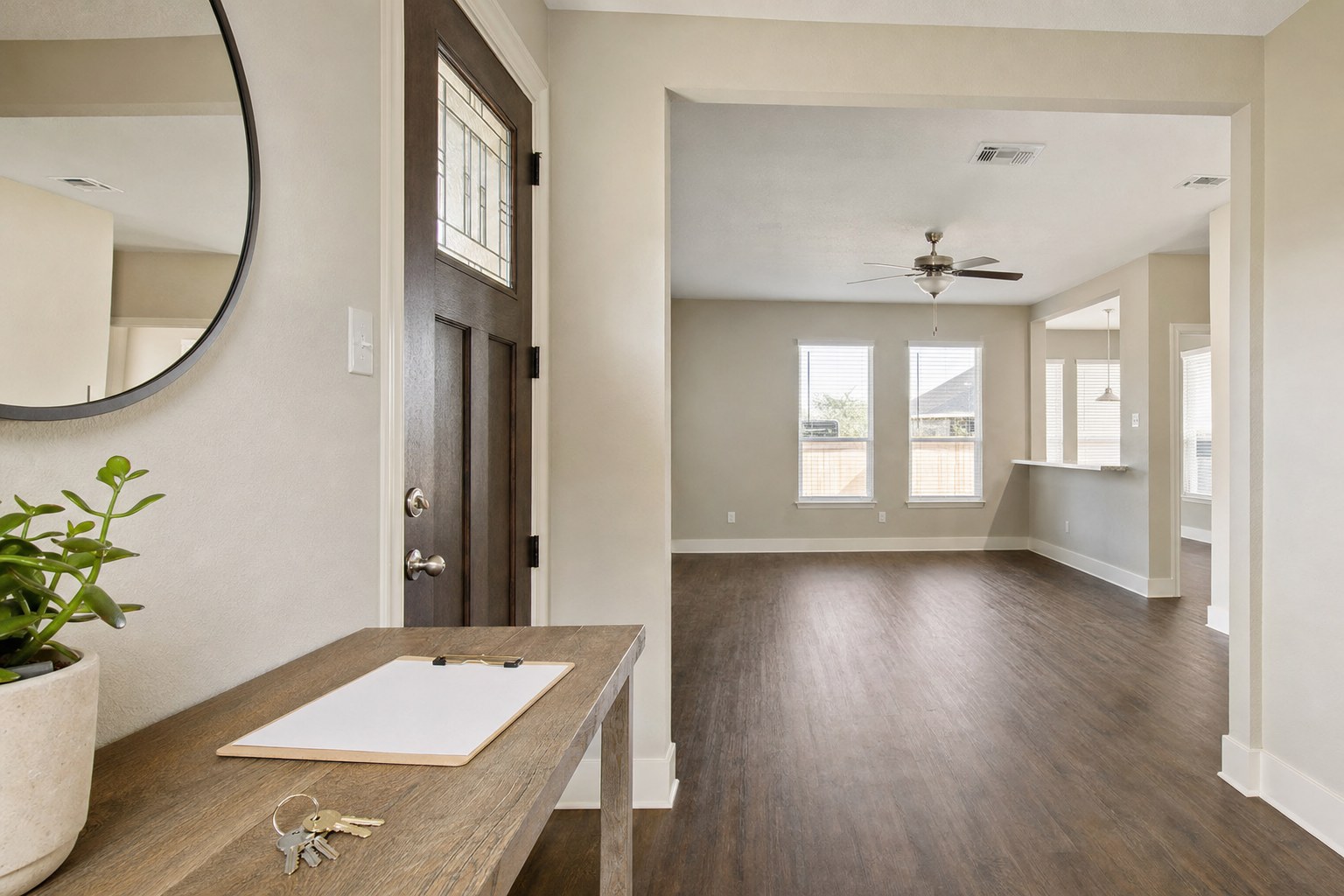 Vacant rental home entry with keys and an inspection clipboard ready for turnover