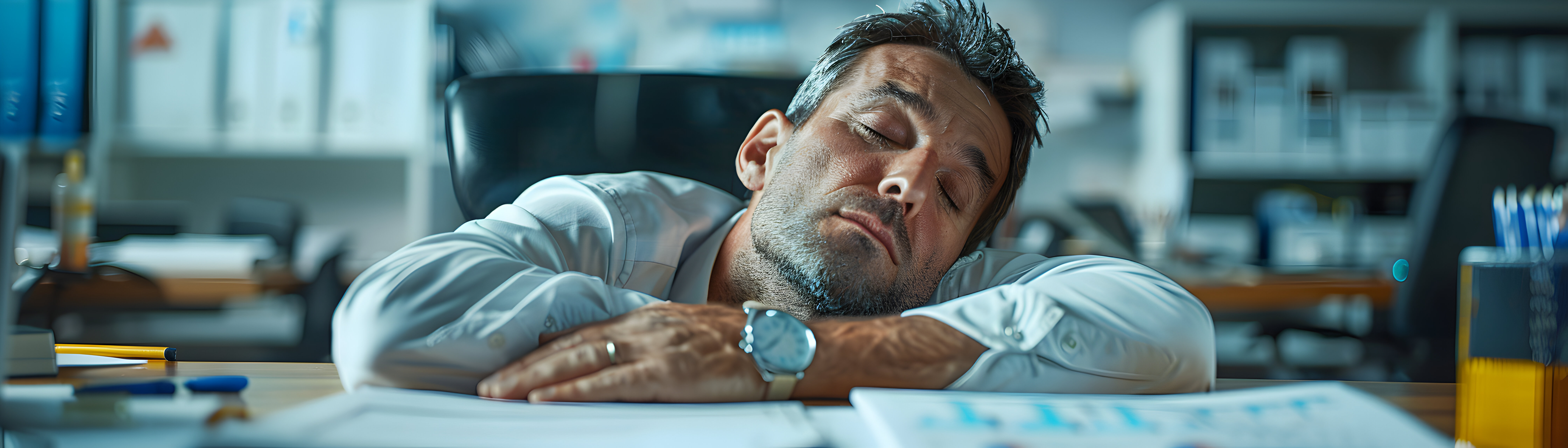Small-business owner reviewing financial paperwork at a desk