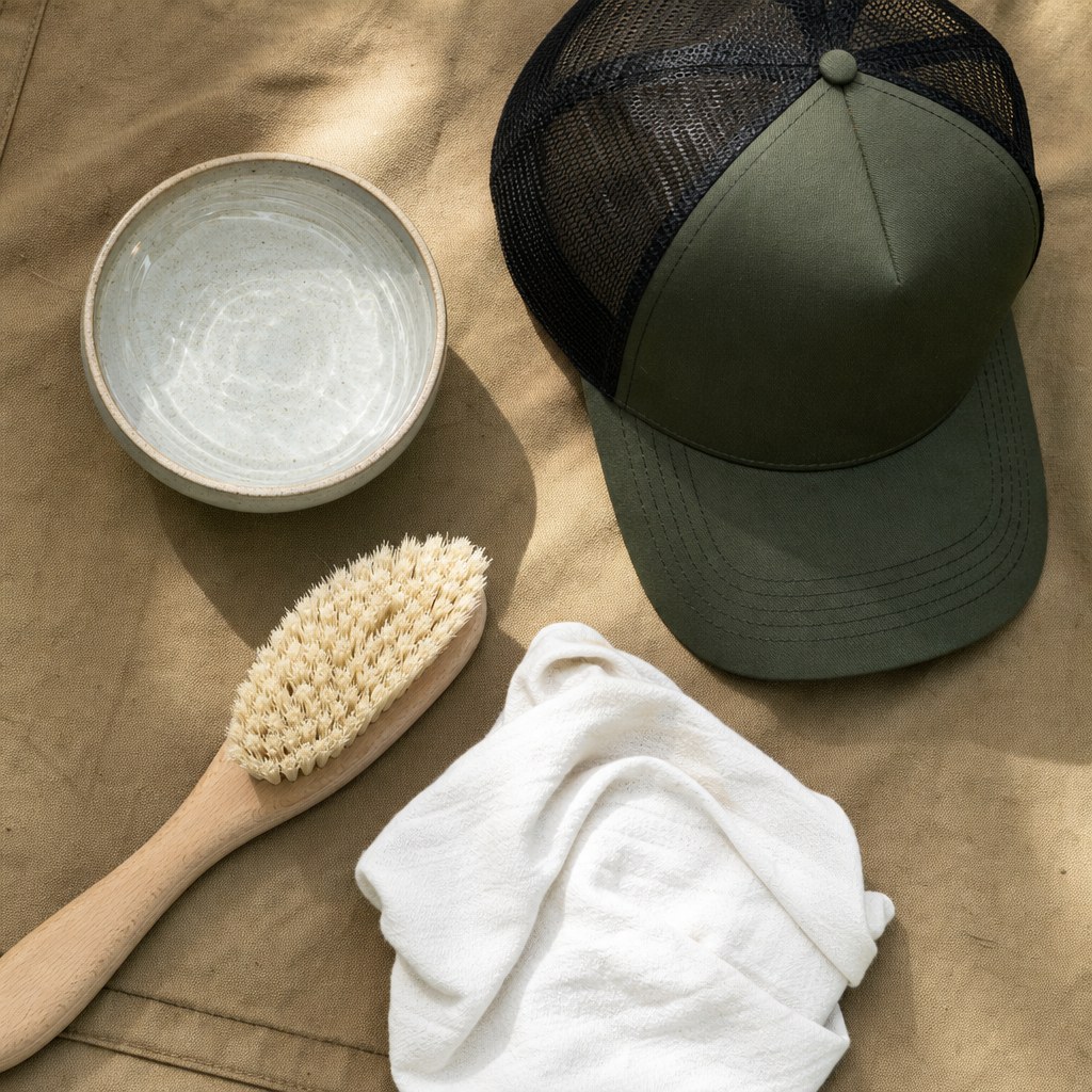 Soft brush, cloth and water for gentle hat cleaning
