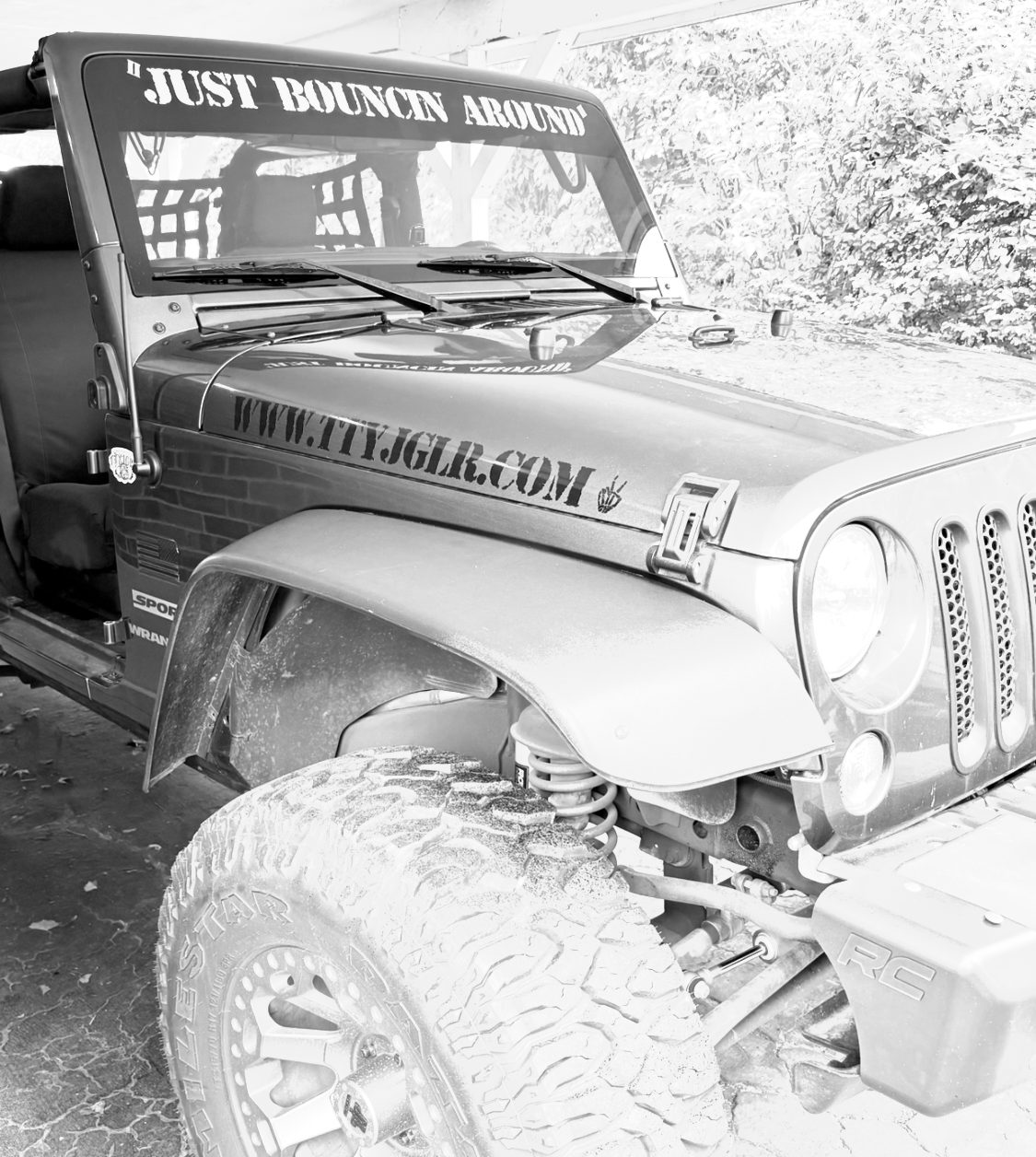 The TTYJGLR Jeep with Just Bouncin Around across the windshield