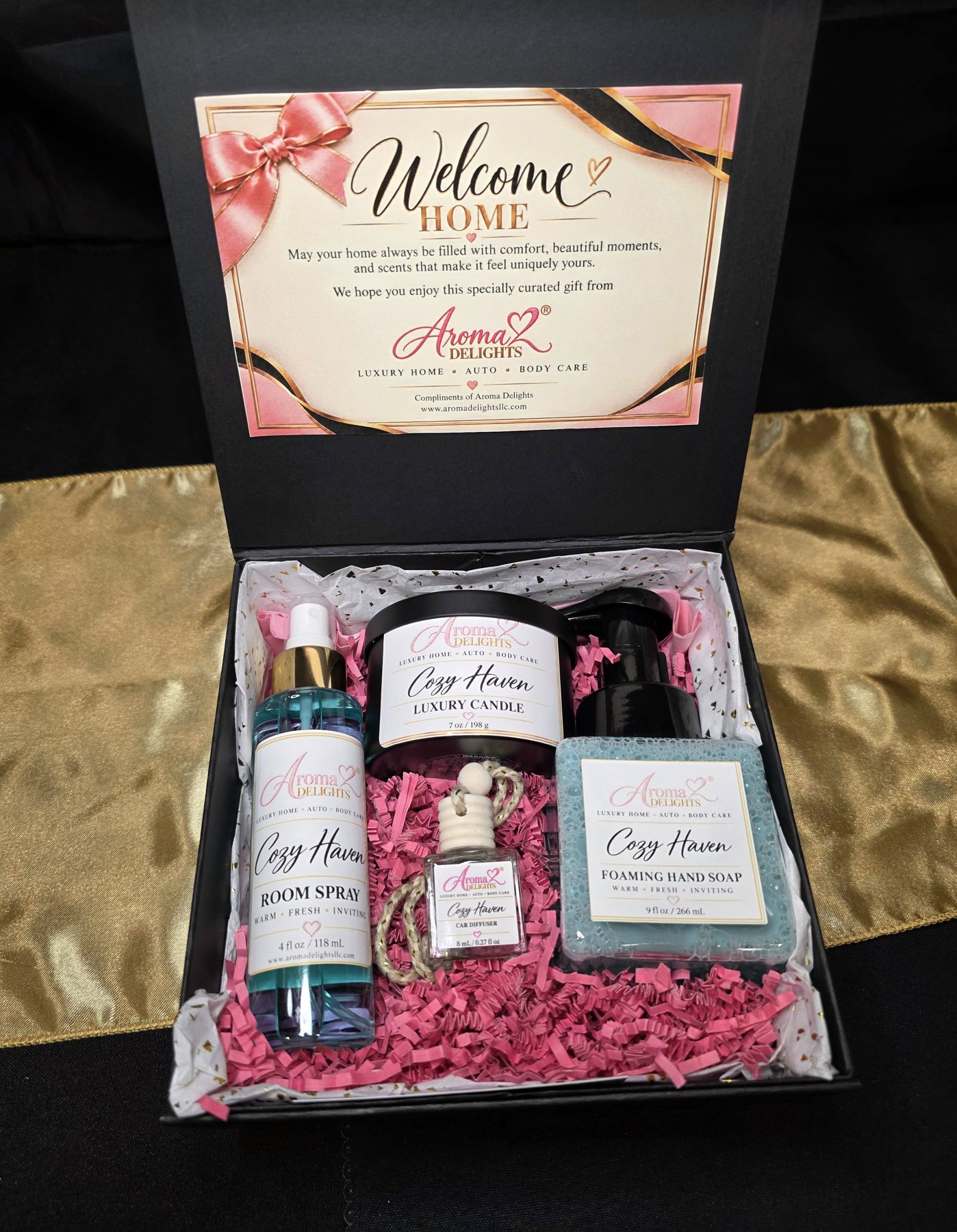 Open realtor appreciation gift box containing Cozy Haven candle, room spray, foaming hand soap and car diffuser