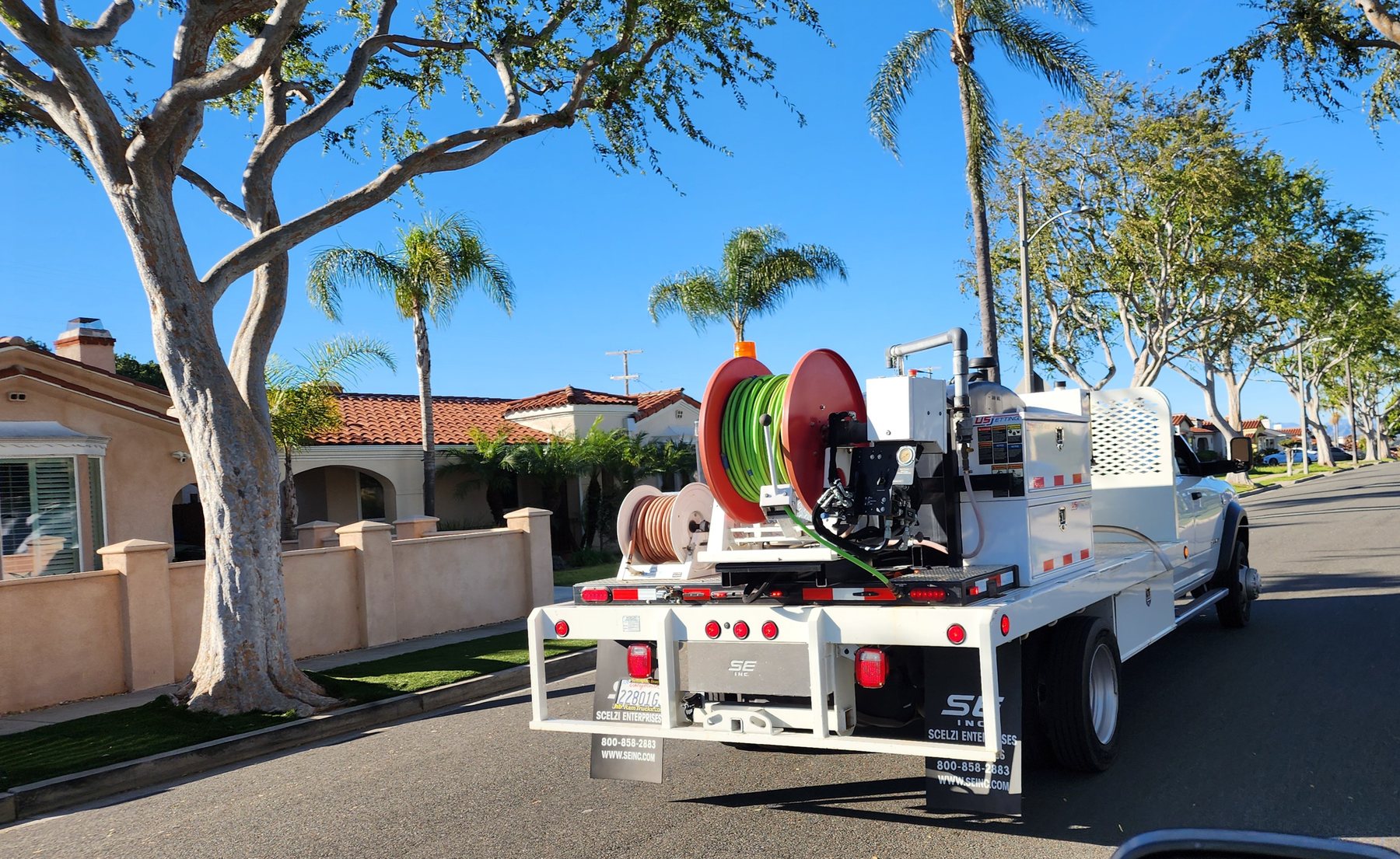 Anytime Rooter service truck and equipment at a residential jobsite