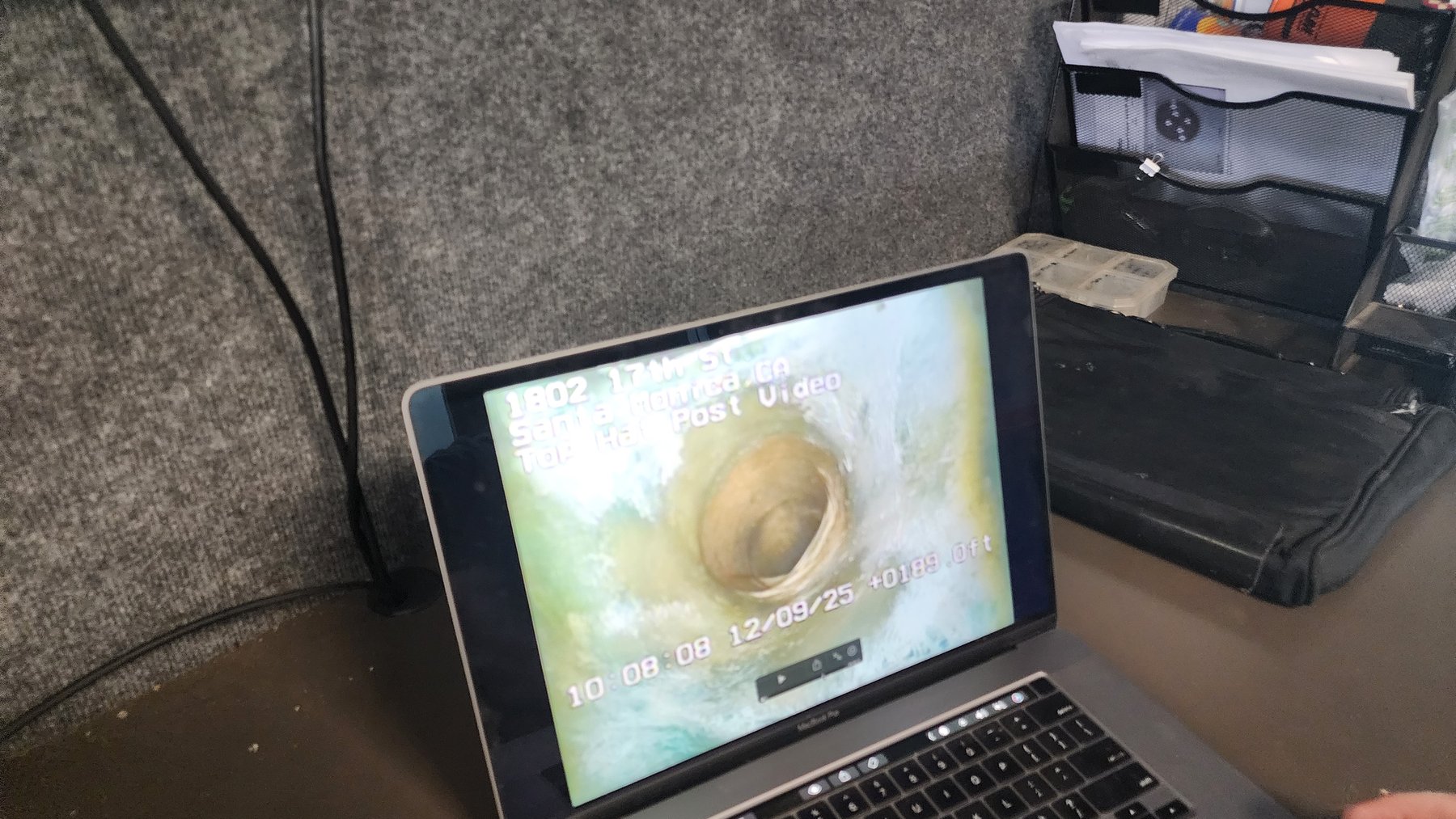 Sewer camera footage displayed on a diagnostic laptop