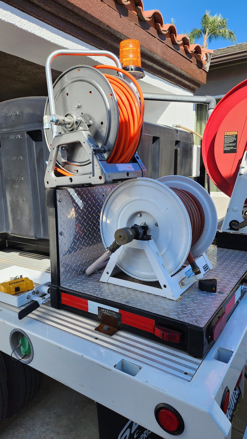 Hydro jetting hose reel prepared for drain cleaning service