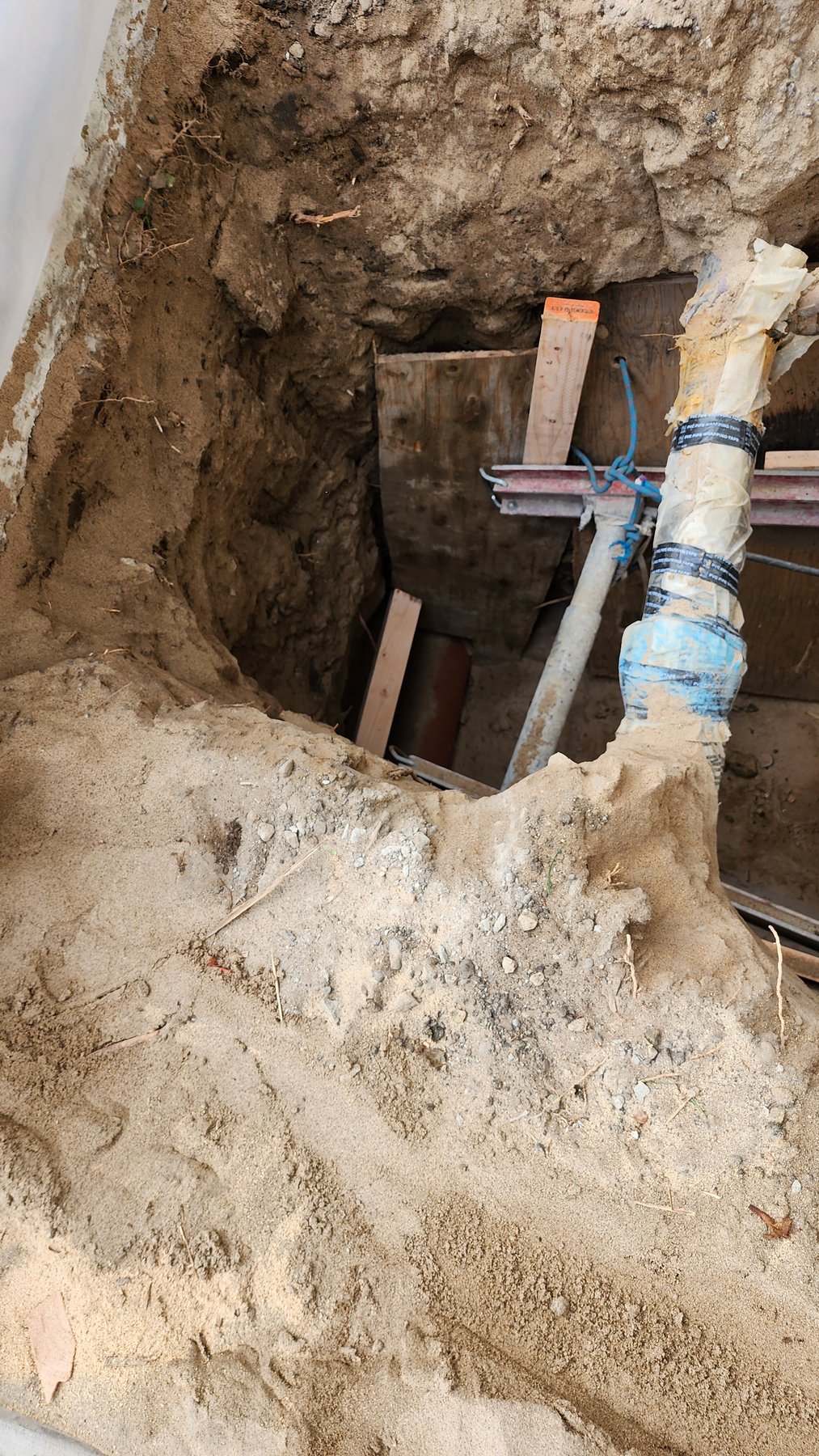 Underground sewer repair preparation at a property