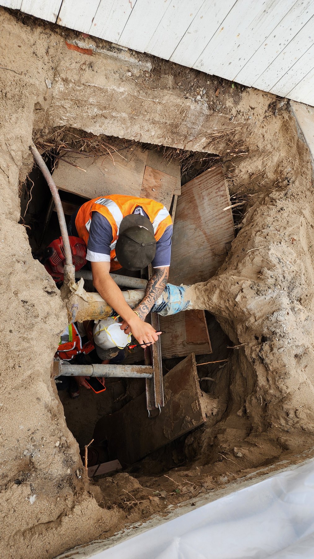 Underground sewer repair work at a property
